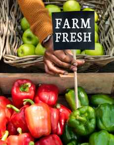 person holding farm fresh label next to bell peppers